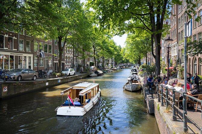 Amsterdam High-End Dutch Food & History Tour - Up to 8 guests - Fish shop: herring, fried cod, and smoked eel