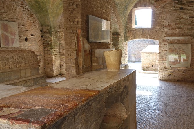 Ancient Ostia Antica Semi-Private Day Trip from Rome by Train with Guide - The 2.5-hour walk: Decumanus Maximus to the Forum and streetscape views