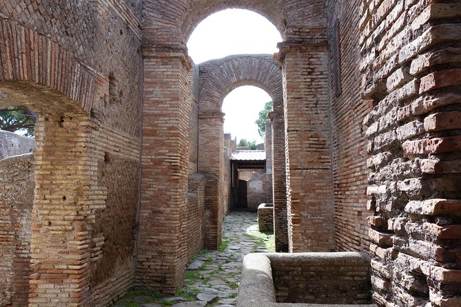 Ancient Ostia Antica Semi-Private Day Trip from Rome by Train with Guide - The amphitheater and the big “how did they fit everyone?” feeling