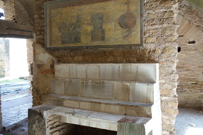 Ancient Ostia Antica Semi-Private Day Trip from Rome by Train with Guide - Shops, apartments, and the part of Ostia that feels most real