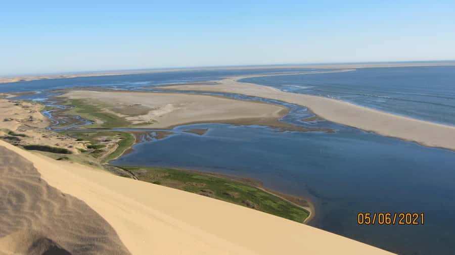 From Walvis Bay: Sandwich Harbour World Heritage Site - Where this tour starts: Walvis Bay’s flamingo lagoon energy