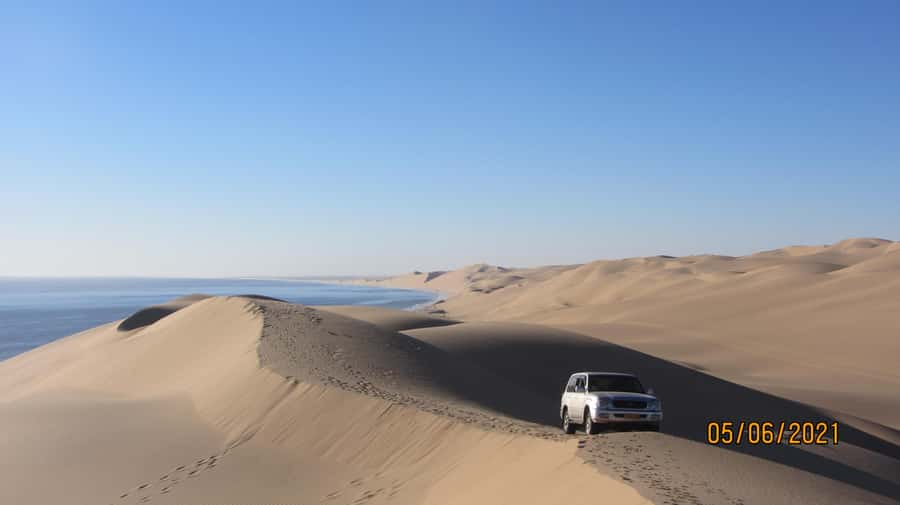 From Walvis Bay: Sandwich Harbour World Heritage Site - Optional add-ons: sandboarding and dune climbing (only if conditions allow)