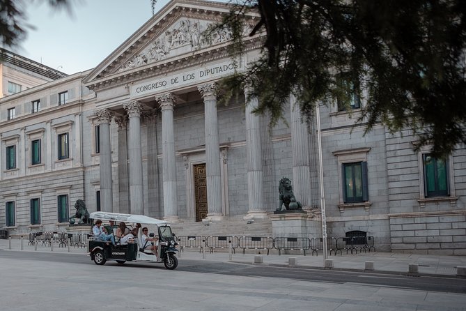 Madrid Historical Tour with Local Guide in Eco Tuk Tuk Private - Atocha Station and the Palace of the Spanish Courts: where Madrid flexes