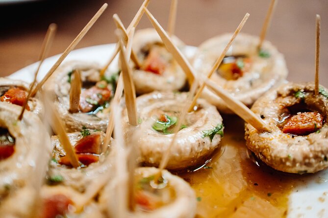 Madrid Tapas & Taverns Small Group Food & History Tour - El Escarpín: Asturian food and a cider pour you’ll remember
