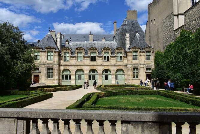 Paris Medieval Heart: Walking Tour in Ancient Marais - Place des Vosges: Paris’s Oldest Square With Stories You Can Spot Later