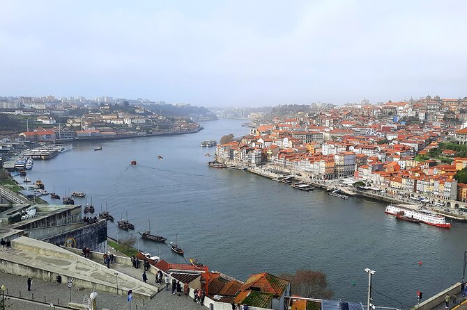 Porto Heritage Night Tour With Fado Show And Dinner Included - Praca da Ribeira Dinner: Where the Night Turns From Drive to Show