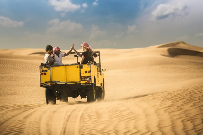 Private Vintage Land Rover Heritage Desert Safari- 4 Course Dinner & Activities - Entering the Dubai Desert Conservation Reserve by vintage Land Rover
