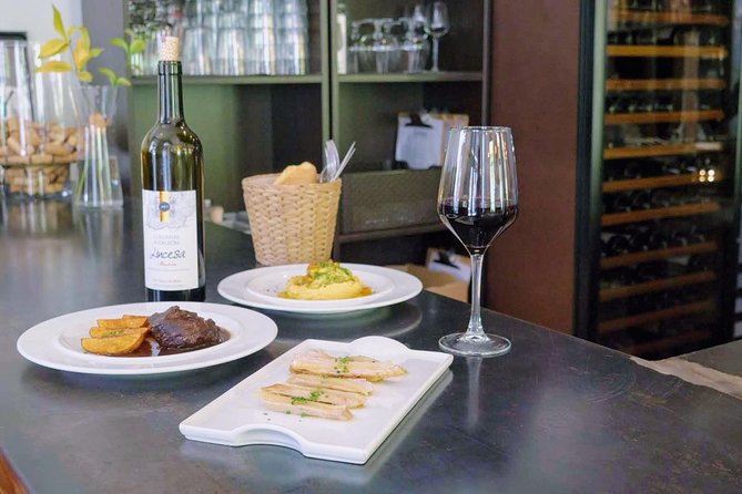 Sevilla Food Tour: Tapas, Wine, History & Traditions - Barrio Santa Cruz: albóndigas, pestiños, and PX in a patio home