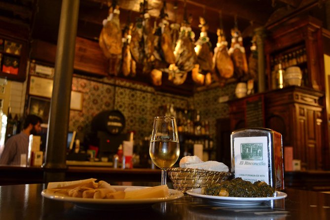 Sevilla Food Tour: Tapas, Wine, History & Traditions - Los Soportales: chicharrones, montaíto, and Cruzcampo from the barrel